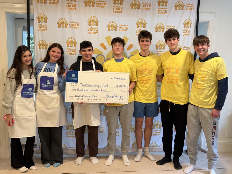 PeaceofCakes team presenting a $1,550 donation check to The Children's Hope Chest